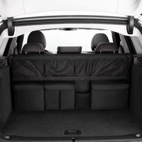 Organisateur de banquette voiture noir installé à l'arrière de la banquette d'un SUV