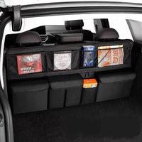 Organisateur de banquette voiture noir rempli, gardant les affaires rangées dans le coffre